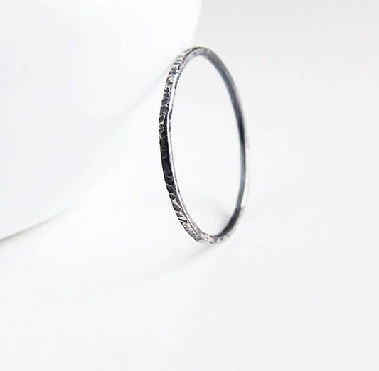 Thin black stack ring